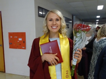 Proudly holding my diploma and roses...